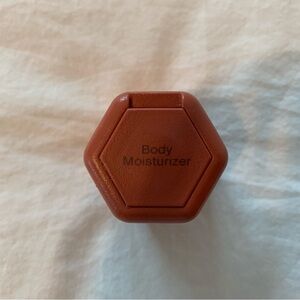 Cadence 1.32 oz body moisturizer travel container